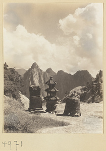 Prayer-paper burner, incense burner, and cast-iron bell on East Peak of Hua Mountain with Qinling Mountains in background