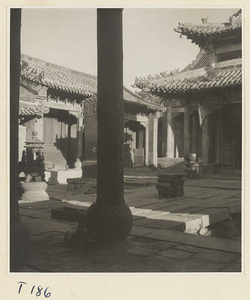 Temple courtyard on Tai Mountain showing memorial stela and incense burners