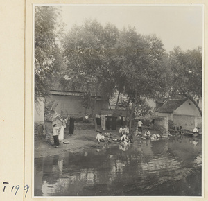 Village women washing clothes in the river at Ji'nan