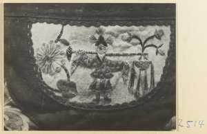 Embroidered purse from a village on the Shandong coast with design showing a figure with a shoulder pole and flowers