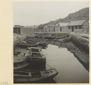 Village with houses and beached fishing boats on the Shandong coast