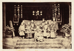 Wealthy merchant and family, Ningpo. The old mother [is] sitting in the center of picture on his right