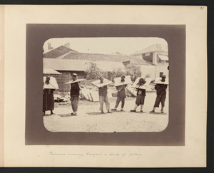 Prisoners wearing cangue, a kind of pillory