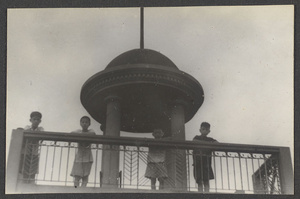Boys looking down from minaret