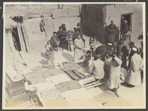 Shunhwa.  Moslem wedding next to Holton's home.  Taken from roof.  Display of goods given by both the bride's and bridegroom's home to the newlyweds.  Note number of pairs of shoes.  Feb. 1932.