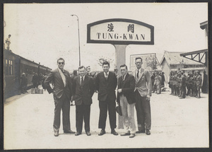 [Tung-kwan railroad station.  Ratslaff (second from left), Rev. Claude L. Pickens (right), and fellow missionaries.]