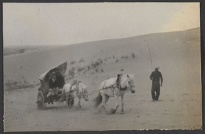 Crossing an arm of the Gobi, the Alashan Desert.  We take turns riding.
