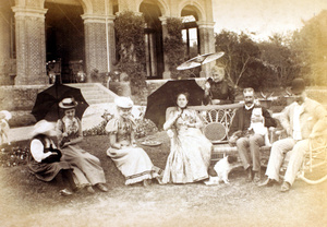 A group relaxing in a garden with pets, Shanghai