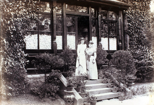 Two women on garden steps