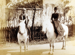 Herbert Wilcockson and Ethel Mary Maitland (née Wilcockson) riding white horses, Shanghai