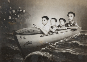 Studio portrait of four boys in a 'boat', Shanghai