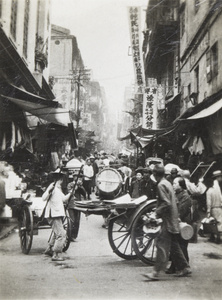 Rickshaws turning in a busy street, Hong Kong