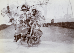 A woman on a wheelbarrow - double exposure