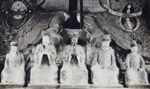 Figures at the feet of Heavenly Kings statues, Longhua Temple, Shanghai (上海)