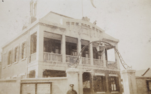 A Chinese policeman (SMP) by an unidentified building, Shanghai
