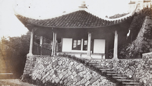 A bungalow with a curved roof