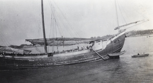 A large junk with furled sails