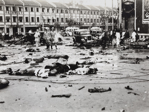 Emergency workers in the aftermath of bombing, 14 Avenue Edward VII and Yu Ya Ching Road, Shanghai, 14 August 1937