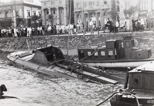 Torpedoed and partially sunk military launch, Shanghai Bund, 1937