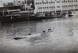 Corpses adrift on a wreck, Soochow Creek, Shanghai, August 1937