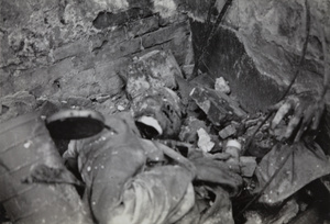 Corpse of Chinese soldier holding a hand grenade, Shanghai, August 1937