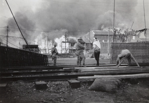 Fires burning while Japanese marines occupy Shanghai North Railway Station, Zhabei, October 1937