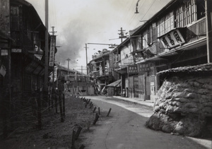 Barricades and sandbag guard posts, Haining Road, Shanghai, 1937