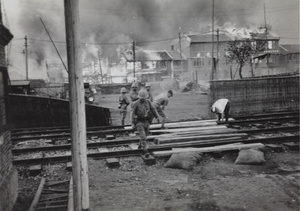 Fires burning while Japanese marines occupy Shanghai North Railway Station, Zhabei, October 1937