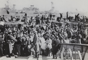 Refugees from Pudong, arriving at the Bund by boat, Shanghai, 1937