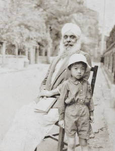 Kartar Singh Sangha, with a Chinese boy, Shanghai