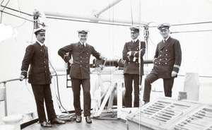 Group of CMCS officers with naval gun