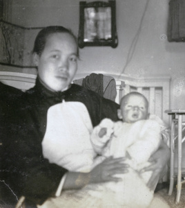 Amah with baby in bedroom