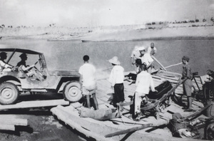 John E. Stanfield driving SOE jeep onto a ferry, 1945
