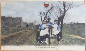 Three women on a wheelbarrow
