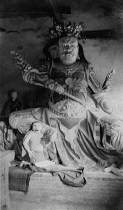 A temple guardian (shrine figure) with a sword