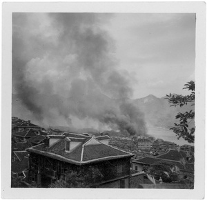 Fires burning an hour after incendiary bombing, Chongqing