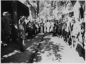 Soldiers and civilians in a street