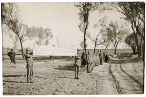 Soldiers holding a banner to welcome Michael Lindsay (林迈可) and other foreigners, and a welcoming party