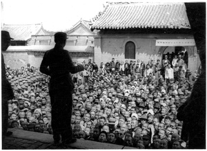 A man addressing a crowd at a mass meeting, Central Hopei
