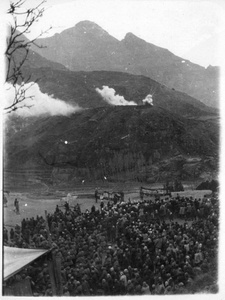Mass meeting to celebrate the end of a Japanese offensive, 2nd Sub-district, Qian Tan, Jinchaji (land mines set off in lieu of fireworks, on the hill), 1 January 1944