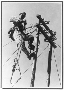 A soldier working as a lineman on telephone or telegraph wires