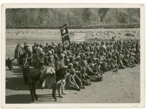 Farewell group of communist soldiers with banners and donkeys