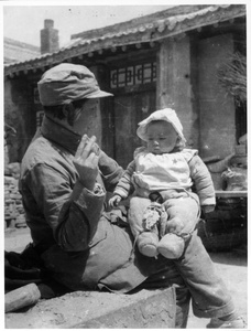 A Chinese friend of the Lindsays with her baby