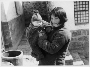 Erica Lindsay wearing a woollen jacket, with Zhang Fengjing, her nurse in Jinchaji