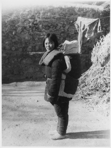 Zhang Fengjin (张凤金), Erica's nurse, with a baby carrier designed by Michael Lindsay (林迈可) for the trek from Jinchaji to Yan'an (延安), March 1944