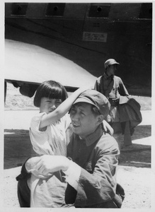 Mao Zedong (毛泽东) and his daughter Li Min (李敏) at Yan'an (延安) airfield, July 1945