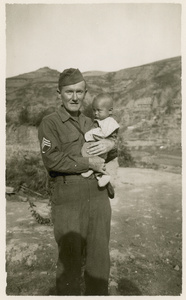 Sergeant Roland Brooks with baby Jim Lindsay, Yan'an (延安), 1945