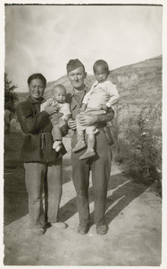 Hsiao Li Lindsay (李效黎) and Sergeant Roland Brooks carrying babies, Yan'an (延安)