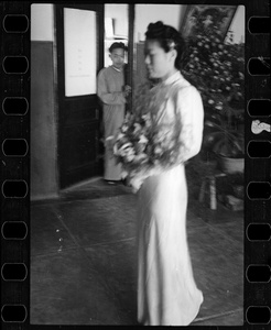 Hsiao Li's bridesmaid, Han Qiufeng (Han Ch'iu-feng), with a man in the background in a doorway, Yenching University (燕京大學), Beijing (北京)