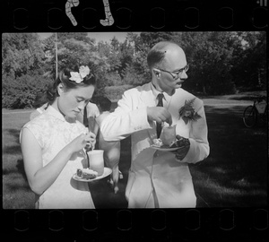 Michael Lindsay (林迈可) and Hsiao Li Lindsay (李效黎), with cake and a drink, at their wedding party at Yenching University (燕京大學), Beijing (北京)